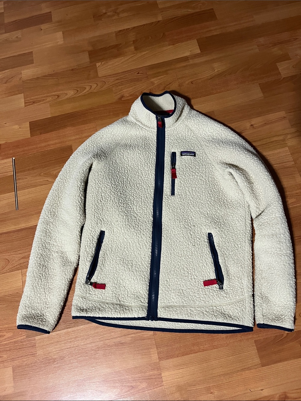 Patagonia Cream Fleece Jacket with Navy Trim and Red Accents